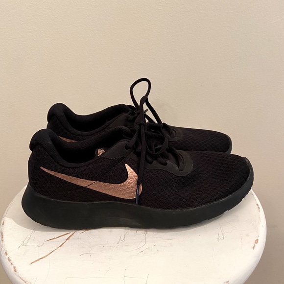black and rose gold nike sneakers